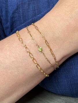 gold bracelet stack with birthsone