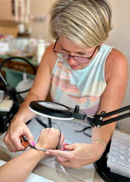 Merissa fitting a bracelet